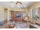 Spacious living room featuring hardwood flooring, a decorative rug, and a built-in entertainment center at 17634 W Verdin Rd, Goodyear, AZ 85338