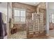 Shower with stone tile walls, glass block window, and pebble floor at 17634 W Verdin Rd, Goodyear, AZ 85338