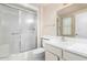 Bright bathroom features a shower and a vanity with white cabinets and a sink at 18002 N 135Th Dr, Sun City West, AZ 85375