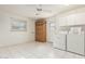 Functional laundry room featuring a ceiling fan, cabinetry, and washer/dryer at 18002 N 135Th Dr, Sun City West, AZ 85375