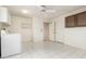 Versatile laundry room with tiled floor, utility sink and washer/dryer hookups at 18002 N 135Th Dr, Sun City West, AZ 85375