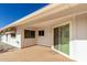 Covered patio with sliding door access, offering a relaxing outdoor living space at 18002 N 135Th Dr, Sun City West, AZ 85375