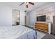 Bedroom featuring neutral walls, wood-look floors, and an ensuite bathroom at 18750 E Ryan Rd, Queen Creek, AZ 85142