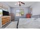 Bedroom with neutral walls, a ceiling fan, and abundant natural light at 18750 E Ryan Rd, Queen Creek, AZ 85142