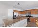 Kitchen with stainless steel appliances, ample counter space, and wooden cabinetry at 18750 E Ryan Rd, Queen Creek, AZ 85142