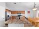 Kitchen featuring stainless steel appliances, an island and attached dining space at 18750 E Ryan Rd, Queen Creek, AZ 85142