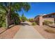 Picturesque sidewalk lined with mature trees and manicured landscaping, creating a welcoming and pedestrian-friendly environment at 18750 E Ryan Rd, Queen Creek, AZ 85142