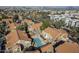 An aerial shot of the condominium community and pool with desert city view at 1905 E University Dr # 219, Tempe, AZ 85288