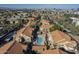 An aerial view of the condominium community pool and surrounding cityscape at 1905 E University Dr # 219, Tempe, AZ 85288