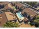 Aerial view of community pool area with sun loungers, hot tub, and landscaped gardens at 1905 E University Dr # 219, Tempe, AZ 85288