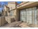 Balcony with views of the neighborhood's buildings through the glass doors and railings at 1905 E University Dr # 219, Tempe, AZ 85288