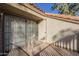 Balcony with serene neighborhood views through the glass doors and railings at 1905 E University Dr # 219, Tempe, AZ 85288