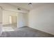 Primary bedroom with walk-in closet and neutral carpet at 1905 E University Dr # 219, Tempe, AZ 85288