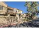 Charming condo complex featuring private balconies and well-maintained landscaping for community living at 1905 E University Dr # 219, Tempe, AZ 85288