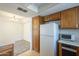 Bright kitchen with white appliances and plentiful cabinetry at 1905 E University Dr # 219, Tempe, AZ 85288