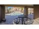 A covered patio with views of the community pool on a sunny day with tables and seating available at 1905 E University Dr # 219, Tempe, AZ 85288