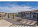 Modern balcony overlooking street and other homes under a blue sky with some clouds at 2121 W Sonoran Desert Dr # 41, Phoenix, AZ 85085