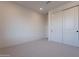 Minimalist bedroom with large wardrobe, neutral carpet and white trim at 2121 W Sonoran Desert Dr # 41, Phoenix, AZ 85085