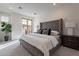 Serene main bedroom with an upholstered headboard and a private balcony at 2121 W Sonoran Desert Dr # 41, Phoenix, AZ 85085