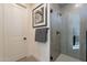 Modern walk-in shower with gray tiling, glass door, and black hardware at 2121 W Sonoran Desert Dr # 41, Phoenix, AZ 85085