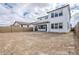 A view of the rear of the house from the partially landscaped backyard at 21250 E Sparrow Dr, Queen Creek, AZ 85142