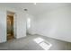 Sunlit bedroom with a glass enclosed shower and neutral carpet, creating a warm and inviting space at 21250 E Sparrow Dr, Queen Creek, AZ 85142