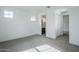 Bright bedroom with neutral carpet, white walls, and ample natural light from the two windows at 21250 E Sparrow Dr, Queen Creek, AZ 85142