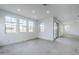 Bright living area with recessed lighting, large windows, and sliding glass door at 21250 E Sparrow Dr, Queen Creek, AZ 85142