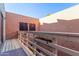 Private balcony featuring decorative lights, railing planters and a door offering serene outdoor space at 2331 E Evans Dr, Phoenix, AZ 85022