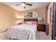 Serene bedroom featuring light walls, plush bedding, and a well-lit ambiance at 2331 E Evans Dr, Phoenix, AZ 85022