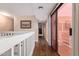 Upstairs hallway featuring sliding glass doors to a balcony at 2331 E Evans Dr, Phoenix, AZ 85022