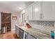 Bright kitchen featuring stone countertops, stainless appliances and a barn door at 2331 E Evans Dr, Phoenix, AZ 85022