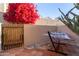 Secluded patio featuring a hammock and vibrant bougainvillea, creating a peaceful outdoor escape at 2331 E Evans Dr, Phoenix, AZ 85022