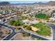 Expansive aerial view of community featuring playgrounds, green spaces, sports fields and wide streets at 24204 N 27Th Pl, Phoenix, AZ 85024