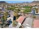 Overhead view of a well-maintained neighborhood with tree-lined streets and community park at 24204 N 27Th Pl, Phoenix, AZ 85024