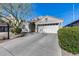 Charming single-story home with a well-manicured front yard and a spacious two-car garage at 24204 N 27Th Pl, Phoenix, AZ 85024