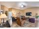 Inviting living room with tile floors and lots of comfortable seating at 24204 N 27Th Pl, Phoenix, AZ 85024