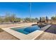 Inviting pool area with privacy fencing and adjacent bar area at 24204 N 27Th Pl, Phoenix, AZ 85024