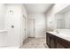 Bathroom showcases a shower with white tile and a dual sink vanity with modern fixtures at 25179 W Atlanta Ave, Buckeye, AZ 85326