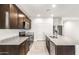 Contemporary kitchen with stainless steel appliances, granite countertops, and ample cabinet space at 25179 W Atlanta Ave, Buckeye, AZ 85326