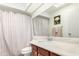 Bathroom featuring a large vanity with granite countertops and a shower and tub combination at 26401 S Brentwood Dr, Sun Lakes, AZ 85248