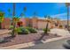 Charming single-story home featuring a spacious two car garage, mature landscaping, and a red double door entrance at 26401 S Brentwood Dr, Sun Lakes, AZ 85248