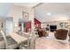 Inviting living room features cozy furniture and a dining area with lots of sunlight at 26401 S Brentwood Dr, Sun Lakes, AZ 85248