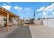 Backyard with covered patio, gravel, and a parked trailer at 2812 W Heatherbrae Dr, Phoenix, AZ 85017