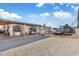 Backyard featuring a gravel area, covered patio, and a metal fence at 2812 W Heatherbrae Dr, Phoenix, AZ 85017