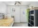 Bedroom with a single bed, white door and a black shelving unit at 2812 W Heatherbrae Dr, Phoenix, AZ 85017