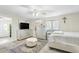 Spacious bedroom featuring a bed, dresser, and a modern ceiling fan for comfort at 2812 W Heatherbrae Dr, Phoenix, AZ 85017