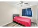 Bedroom with a bed and red bedding, offering a cozy place to rest and unwind at 2812 W Heatherbrae Dr, Phoenix, AZ 85017