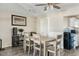 Inviting dining area with wood table set, seamlessly connecting to the kitchen, perfect for Gathering gatherings at 2812 W Heatherbrae Dr, Phoenix, AZ 85017