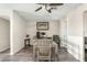 Dining area with a wood dining table that compliments the neutral color palette and modern decor at 2812 W Heatherbrae Dr, Phoenix, AZ 85017